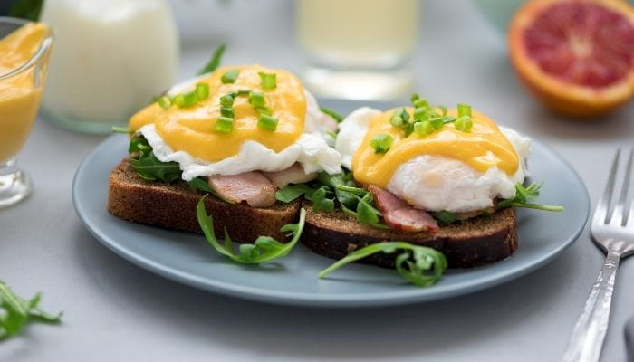 Eggs Benedict with Bacon and Arugula